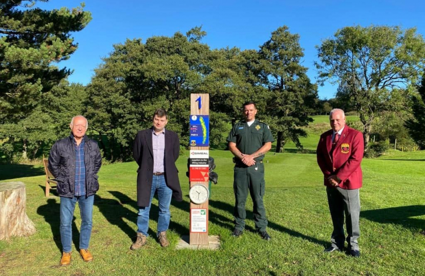 Robert at Chapel-en-le-Frith golf club, at their previous defibrillator initiative, along with the East Midlands Ambulance Service